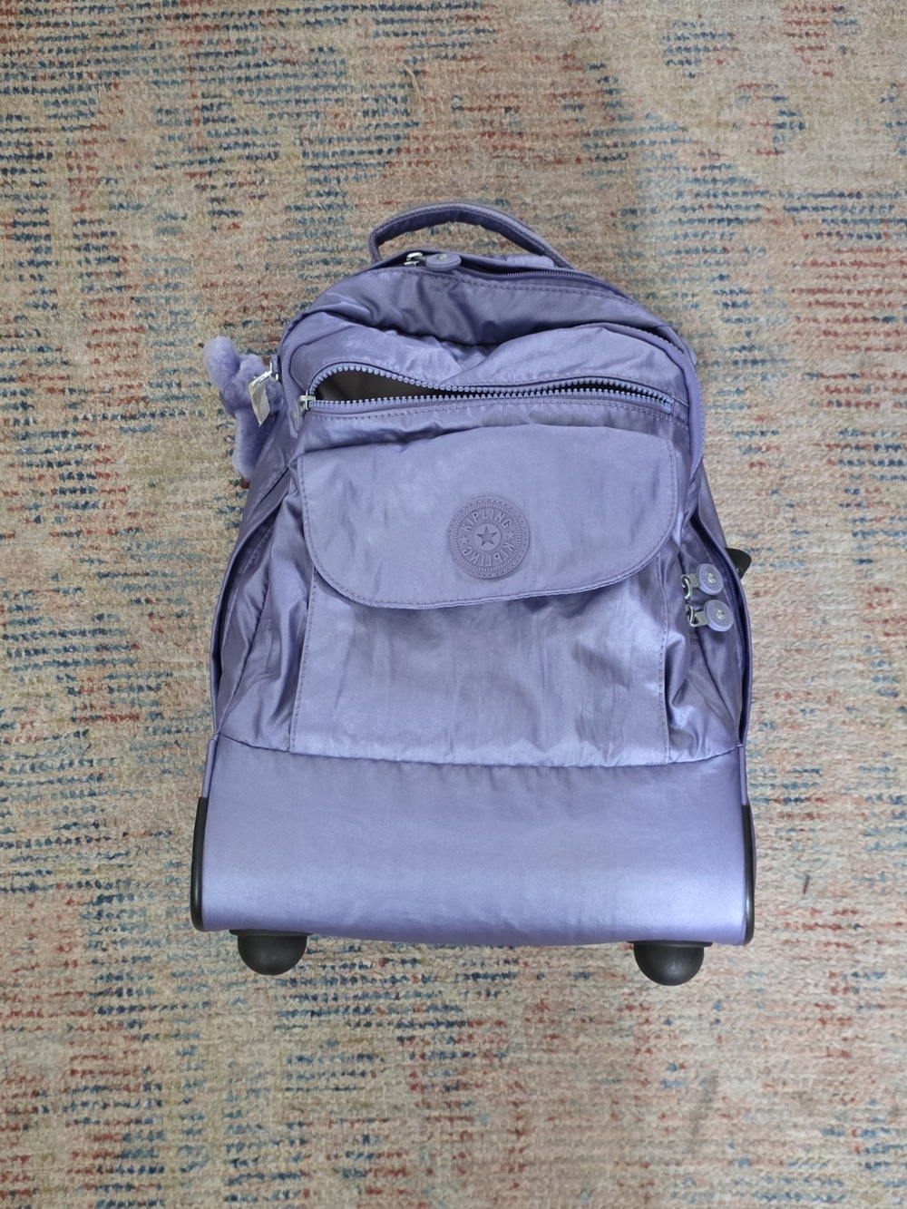 Kipling Lavender Purple Rolling Backpack with Monkey Charm